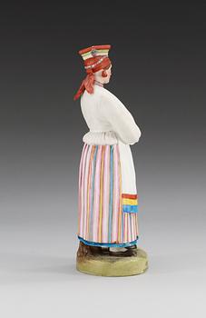 A Russian figure of a peasant woman from the Voronezh province, Gardner manufactory, ca 1900.