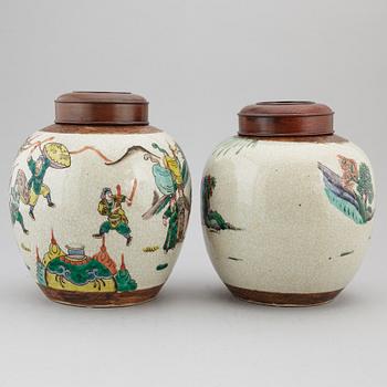 Two Chinese famille verte jars with wooden covers, first half of the 20th century.