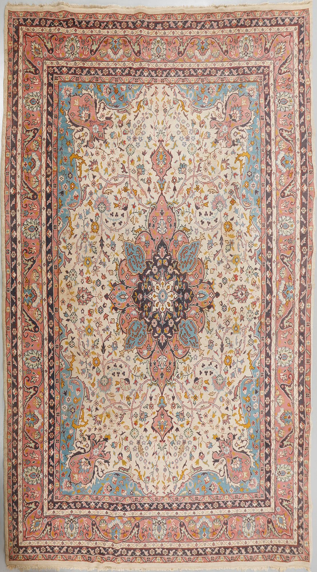 A rug from Smyrna, semi-antique, 417 x 300 cm.