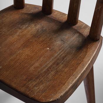 Axel Einar Hjorth, a set of four stained pine "Utö" chairs, Nordiska Kompaniet, Sweden, 1930s.