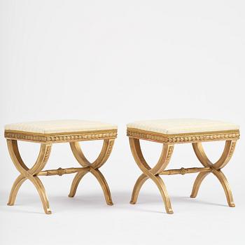 A pair of late Gustavian giltwood stools, Stockholm, late 18th century.