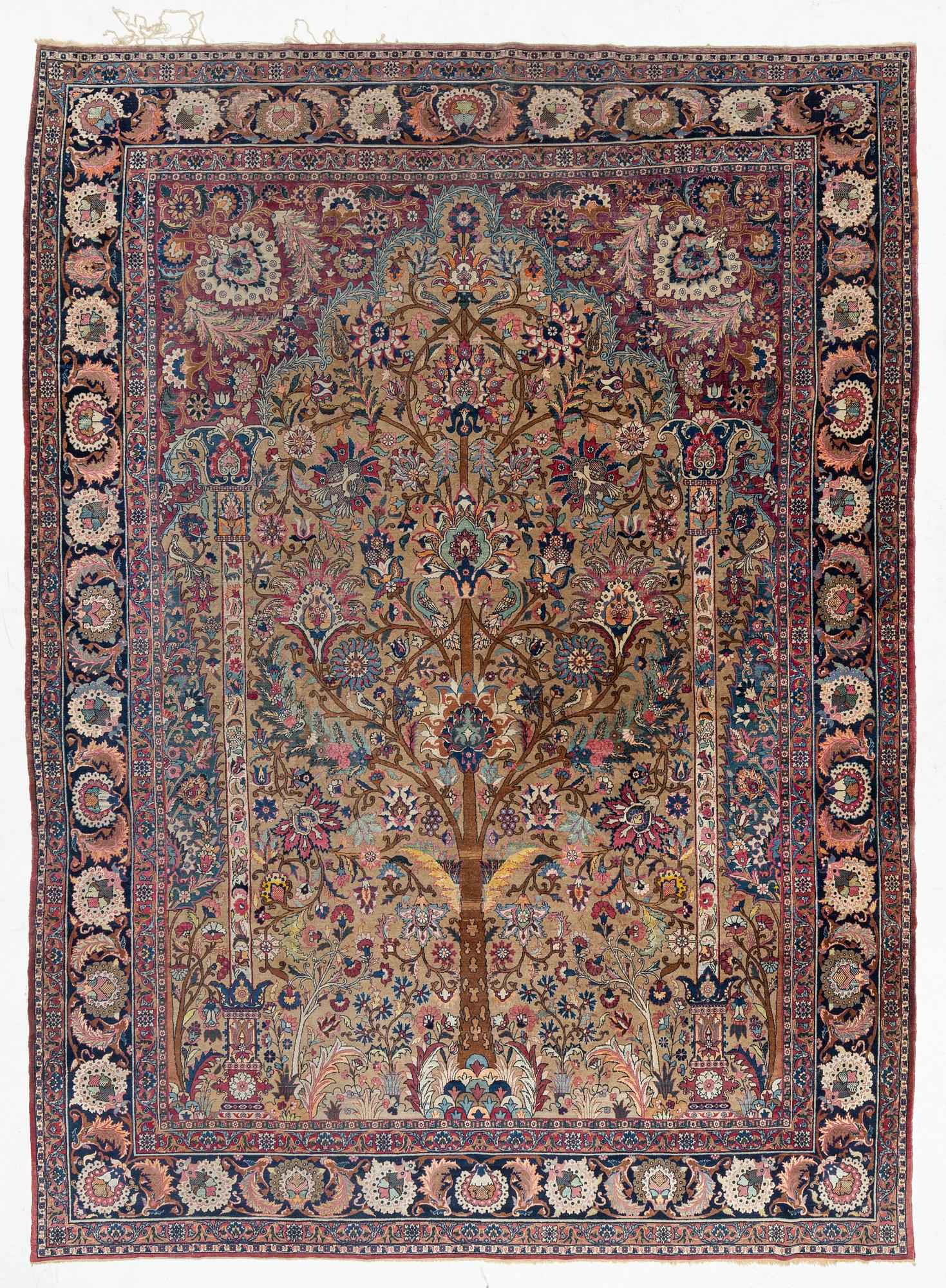An antique/semi-antique Kerman carpet c 415 x 305 cm.