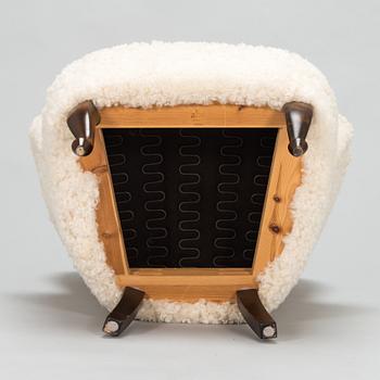 A contemporary sheepskin upholstered lounge chair, ABC collection.