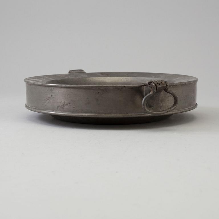 A 19th century pewter plate.