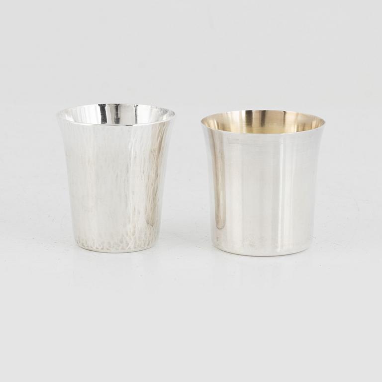 A set of 16 silver cups, including GAB, Stockholm 1964.