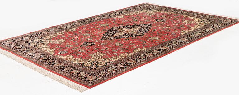 A 1960's silk Qum carpet, c. 312 x 201 cm.