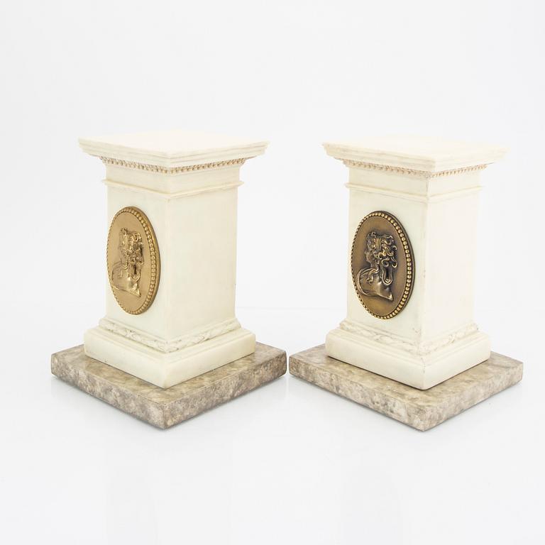 A pair of modern plaster statues of Napoleon.