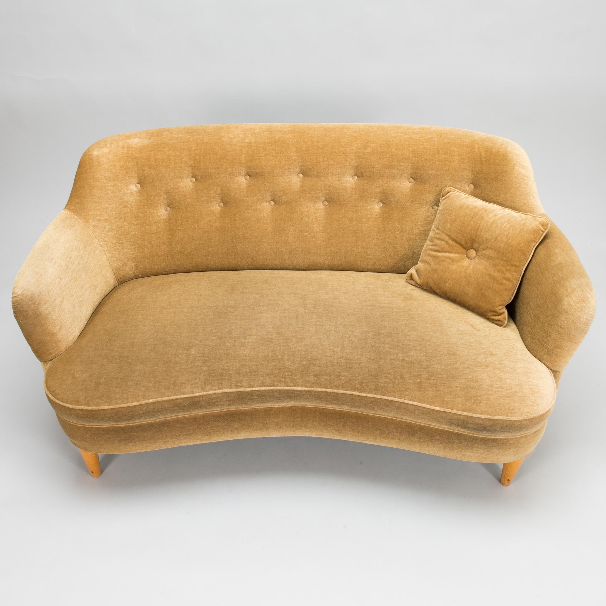 A mid-20th-century sofa and armchair.