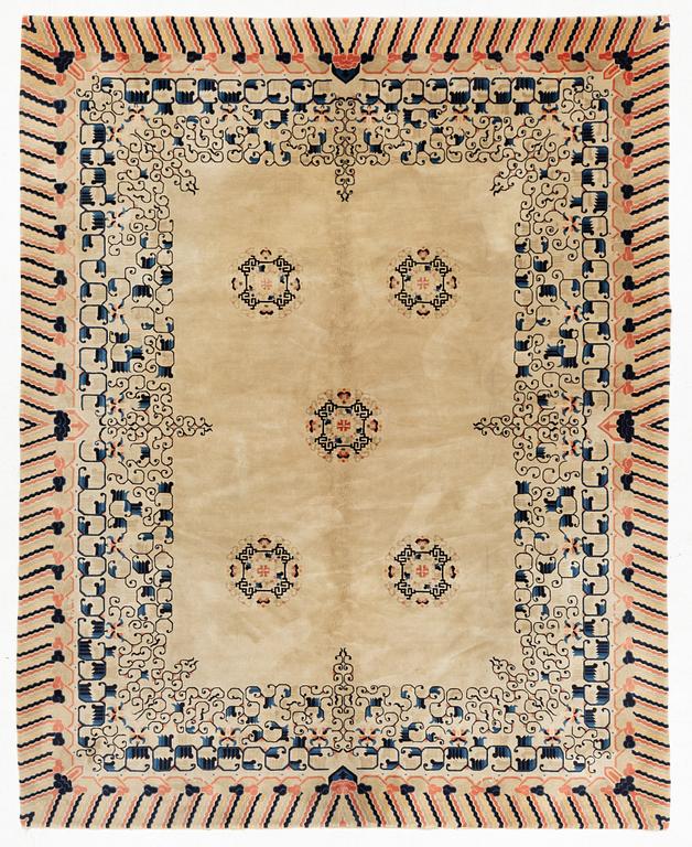 A semi.antique Chinese carpet, c 310 x 228 cm.