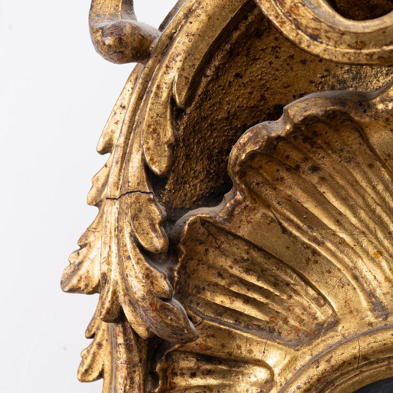 A Rococo mirror, 18th century.