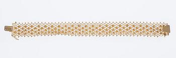 ARMSMYCKE, 18K guld. 1900-talets senare hälft. Vikt 19,3 g.