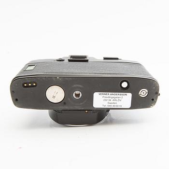 Leica R4s camera body, lens, and accessories.