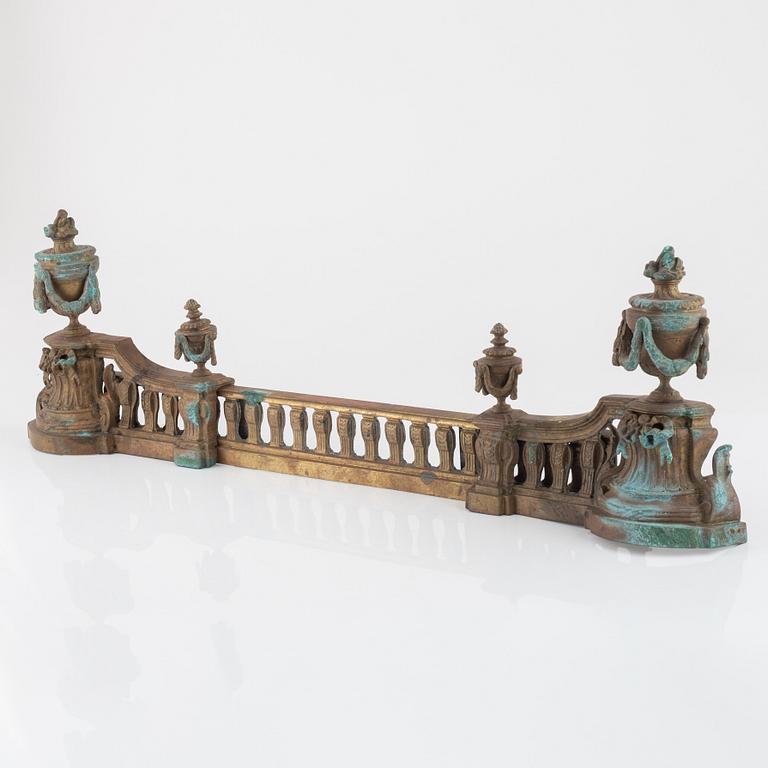 A Louis XVI style bronze grate, 19th Century.