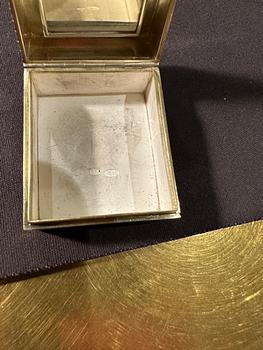 A Fabergé gold, silver-gilt and enamel stamp box, workmaster Henrik Wigström, St Petersburg 1908-17.