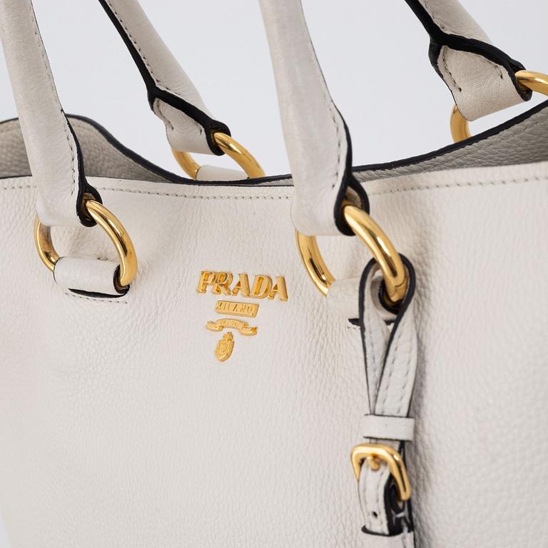 Prada, a white leather handbag.