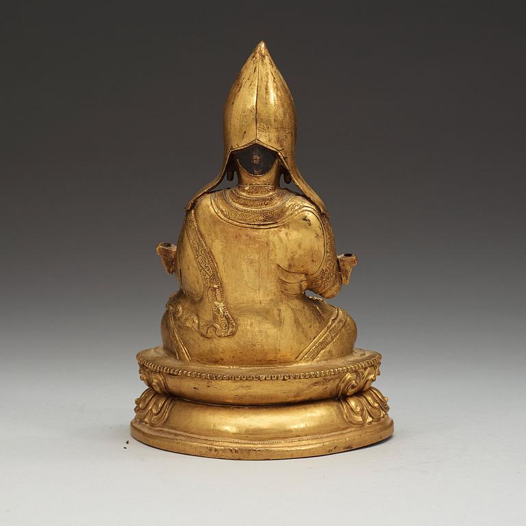A Sino-Tibetan gilt copper alloy repoussé figure of Tsong Khapa, 18/19th Century.