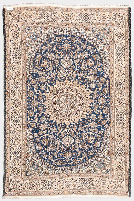 A carpet, Nain, part silk, ca. 295 x 201 cm.