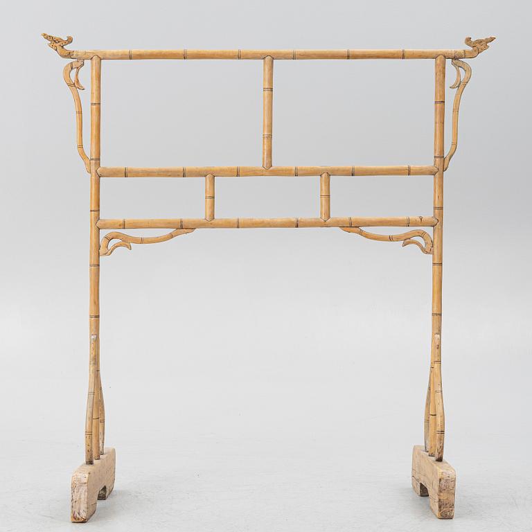 A Chinese bamboo and hardwood clothes rack, 20th century.