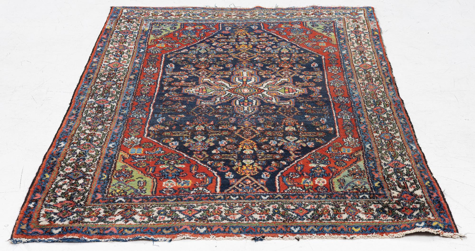 An oriental, semi-antique rug, c. 195 x 130 cm.