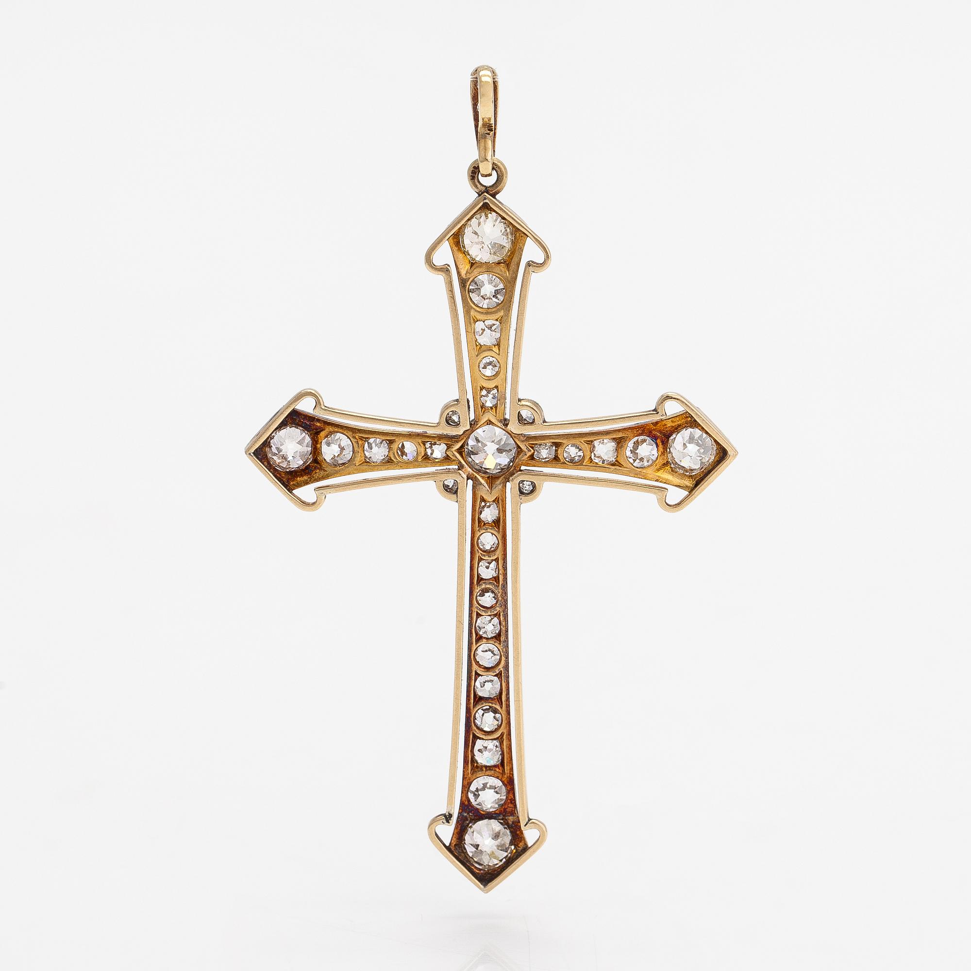An 18K gold cross pendant with old-cut diamonds ca. 5.43 ct in total. With certificate.