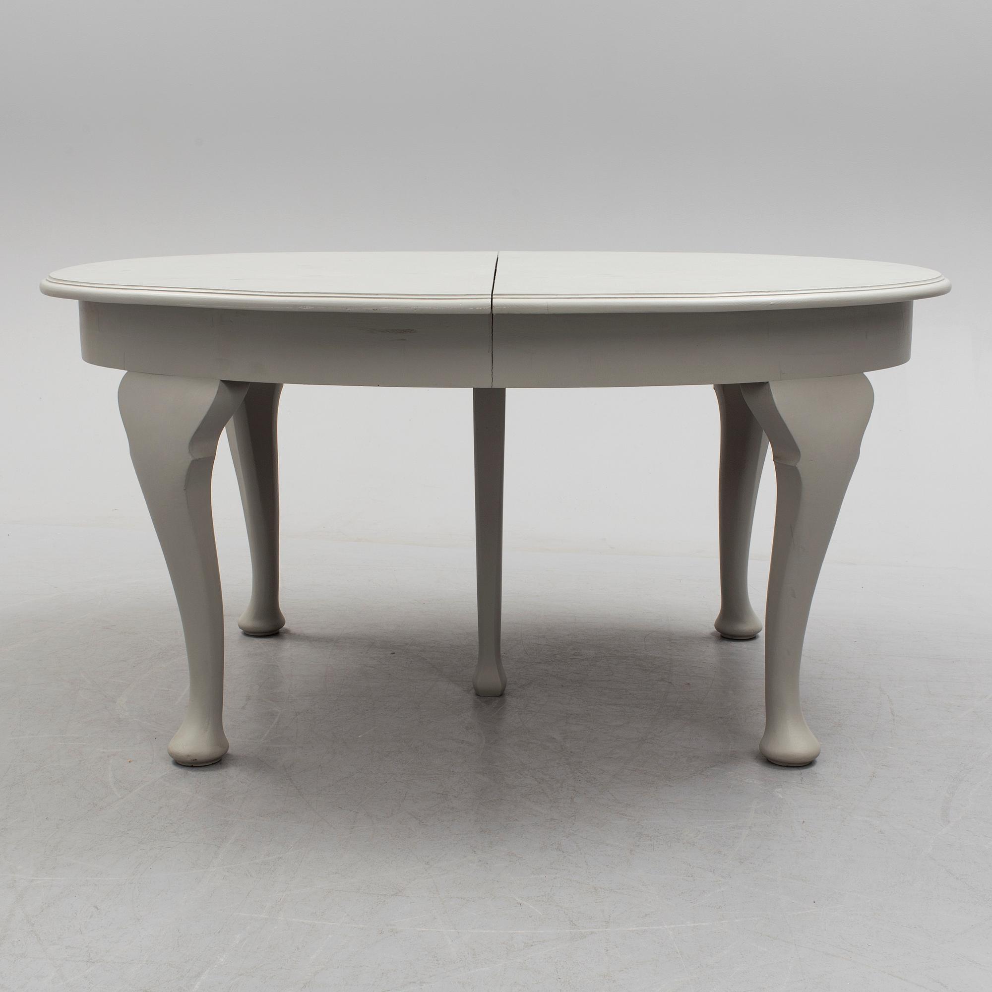 A painted Rococo style dining table, circa 1900.