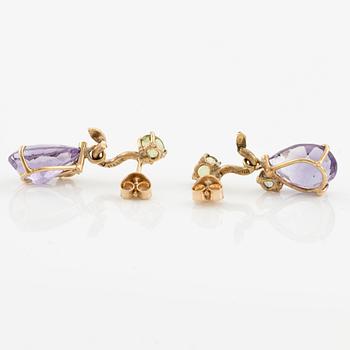 Earrings with drop-shaped faceted amethysts, peridot, and small diamonds.