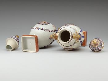A pair of 'Marieberg shaped' jars with covers, Qing dynasty, Jiaqing (1796-1820).