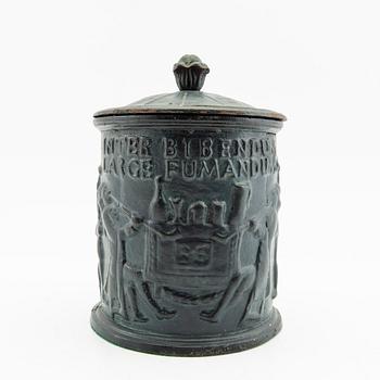 Tobacco tin, cast iron, early 20th century.