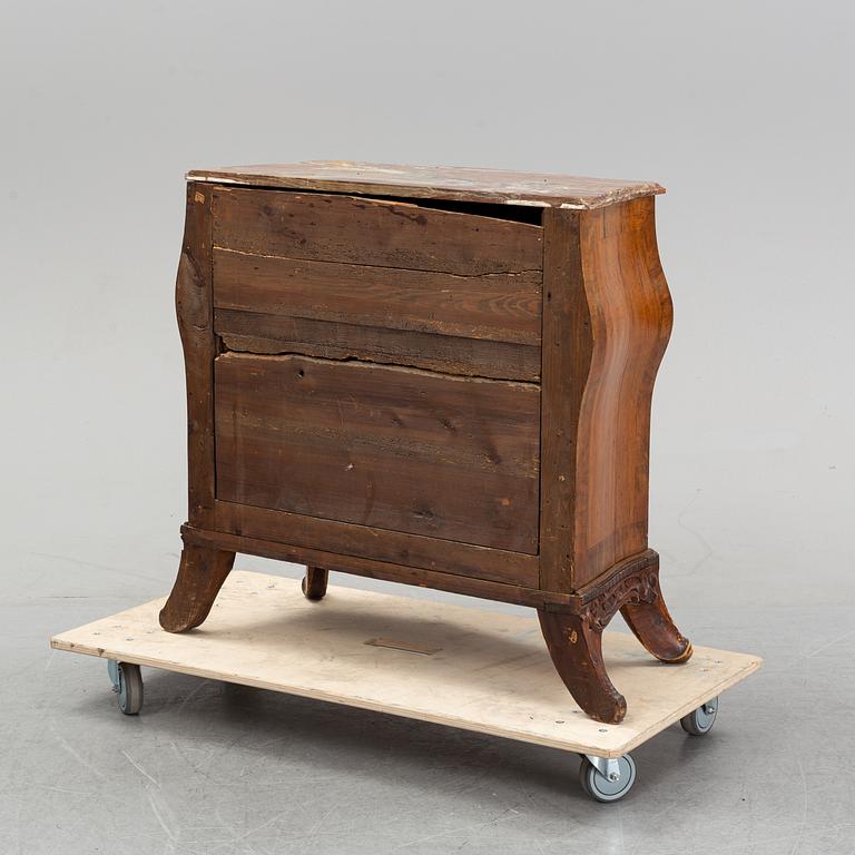 A 19th Century rococo style chest of drawers.