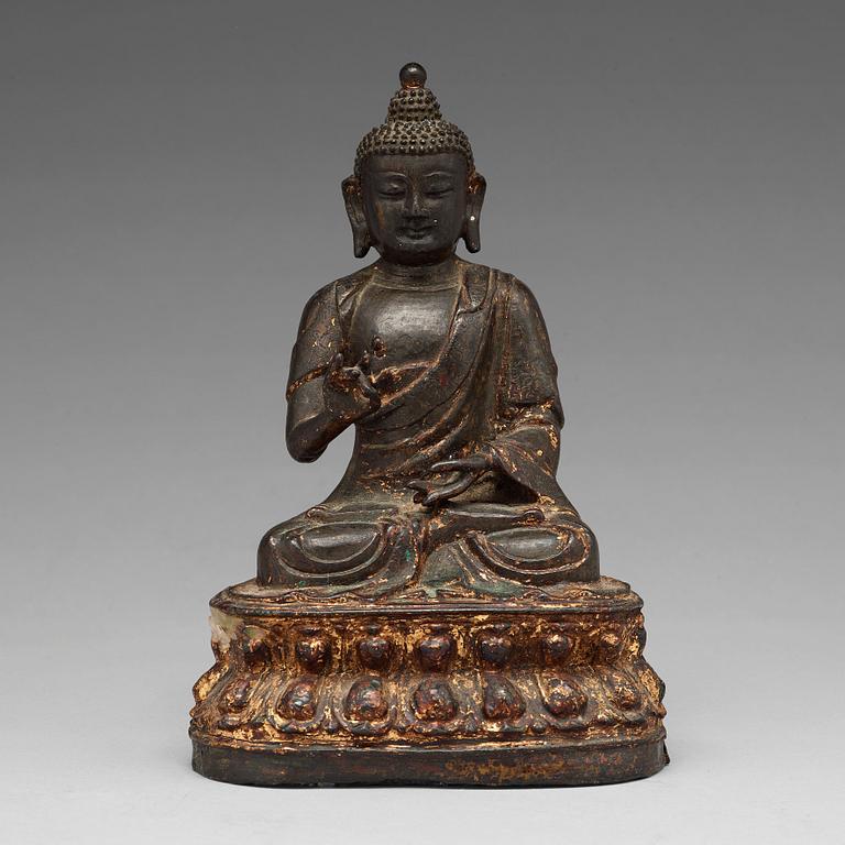 A bronze figure of Buddha, Ming dynasty (1368-1644).