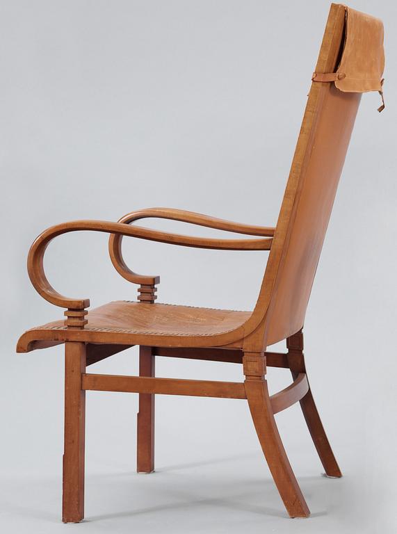 A Hjalmar Jackson pear wood and brown leather easy chair, Stockholm 1934,