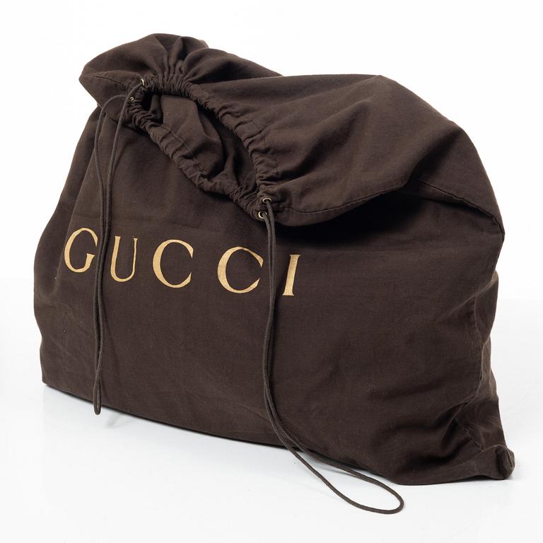 Gucci, GG Supreme bag.