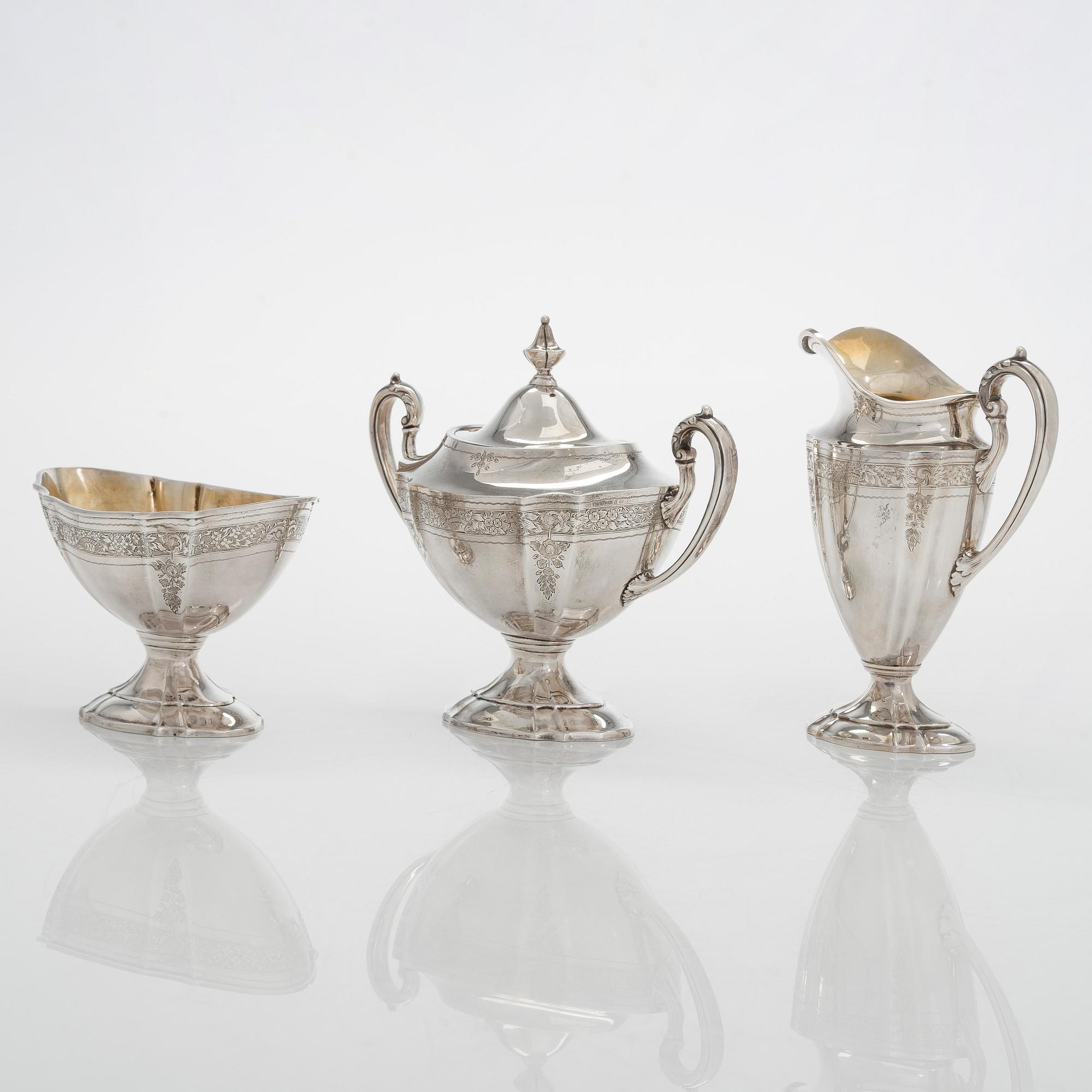 A five-piece sterling silver coffee and tea service, and 12 spoons, USA, first quarter of the 20th century.