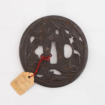 A Japanese iron Tsuba, Edo, signed Nanki Seishindo.