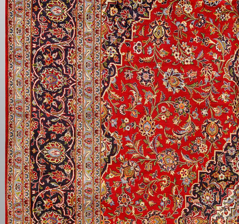 A carpet, Keshan, signed, c. 488 x 294 cm.