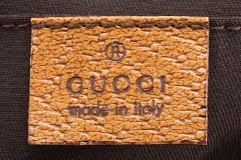 A GUCCI BAG, "STUDDED  BAMBOO HANDLE".