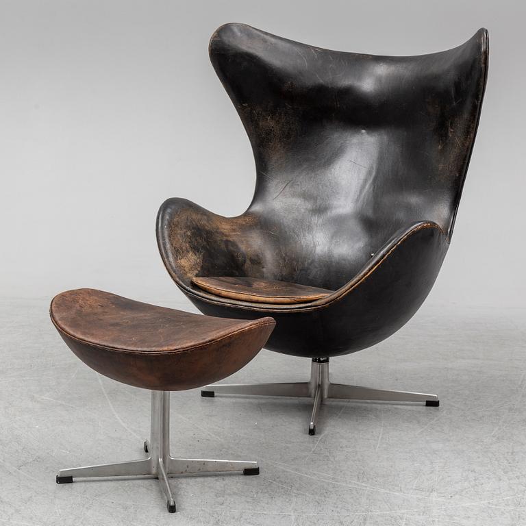 ARNE JACOBSEN, an 'Egg' leather covered easy chair and ottoman, Fritz Hansen, Denmark.