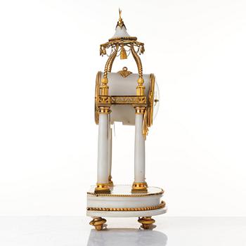 A Louis XVI mantel clock.