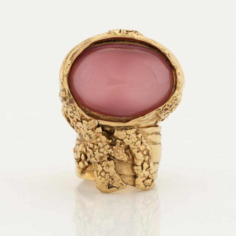 An Yves Saint Laurent ring.