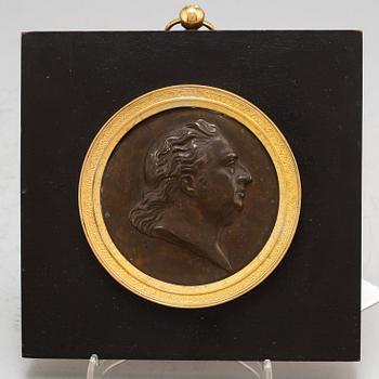 A Swedish Empire copper and gilt bronze portrait medallion representing Johan Tobias Sergel.