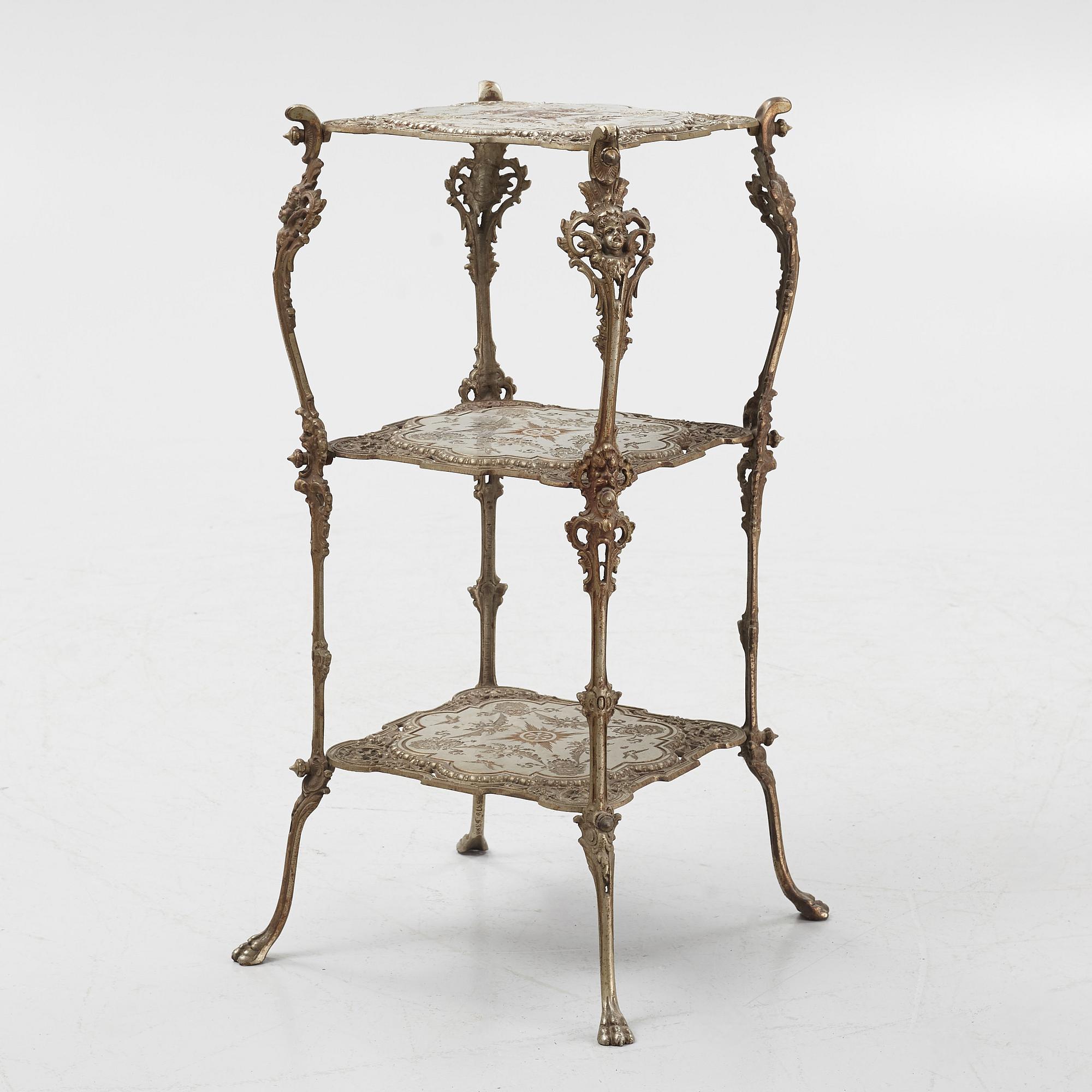 A three-tiered metal pedestal, first half of the 20th century.