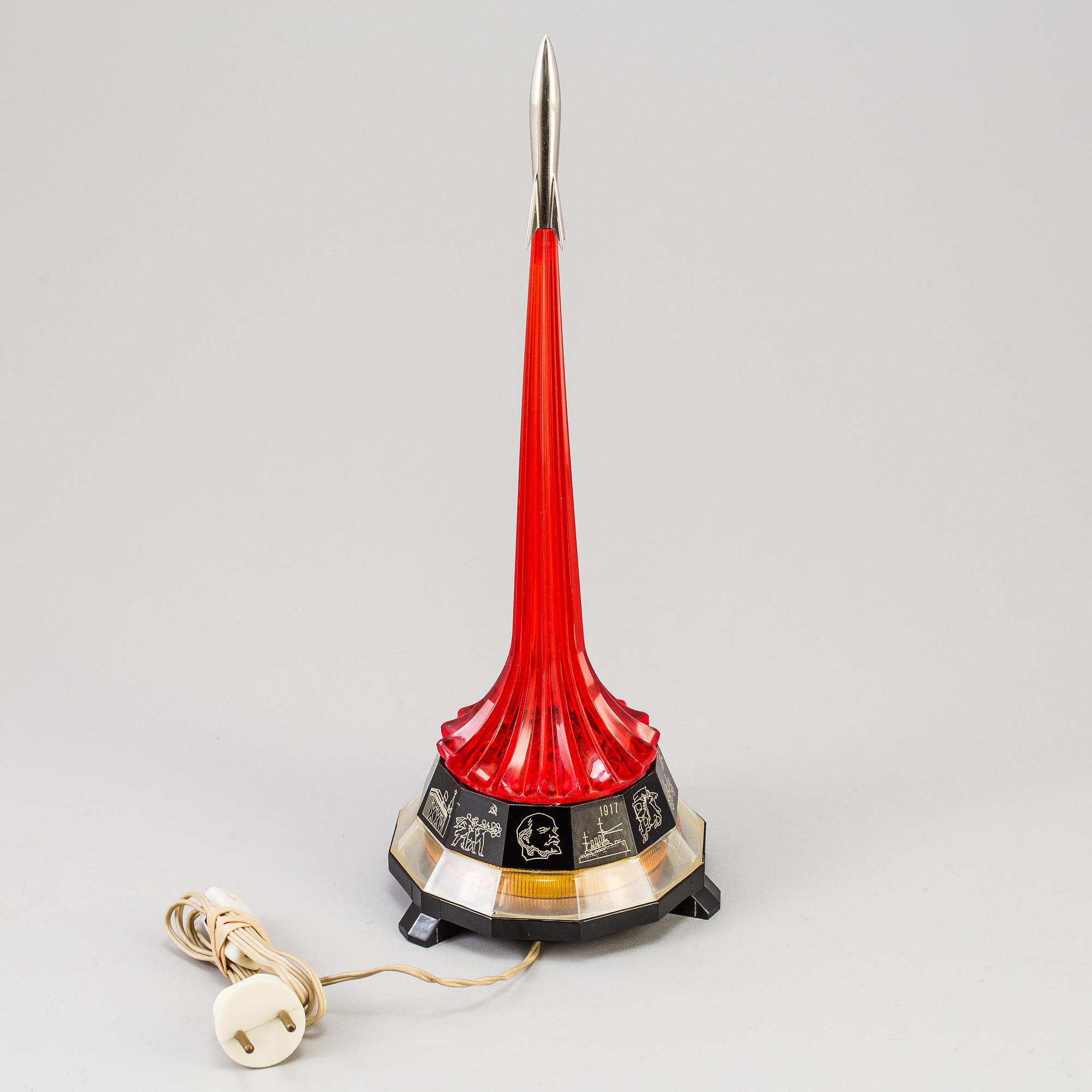 Soviet perspex table lamp with a rocket Finial, depicting Yri Gagarin's trip in space, the base showing Soviet symbols.