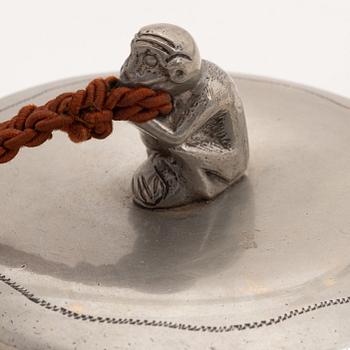 A 1930s hand held pewter mirror.