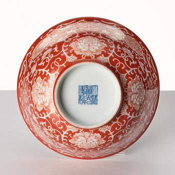 A coral red reverse decorated lotus bowl, Qing dynasty with Daoguang mark in underglaze blue.