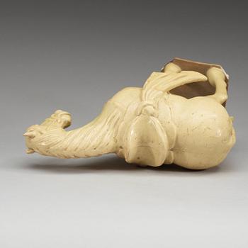 A yellow glazed pottery figure of a horze, presumably Tang dynasty (618-907).