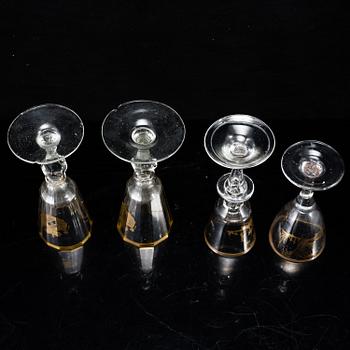 A set of four odd glasses, early 19th Century.