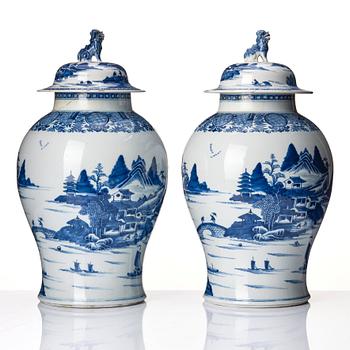 A pair of blue and white Chinese porcelain jars with covers. Qing dynasty, Qianlong (1736-95).