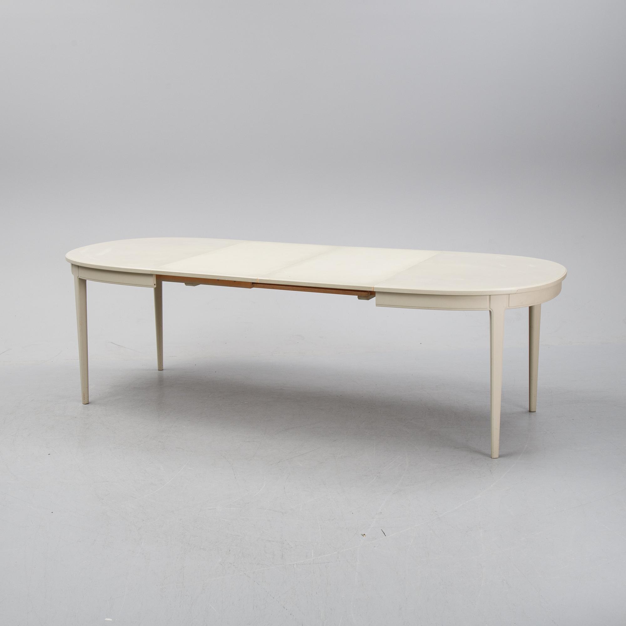 A dining table and six chairs by Carl Malmsten for Bodafors.