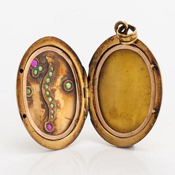 A 14K gold locket with synthetic rubies and demantoid garnets. St. Petersburg, 1908-1926.