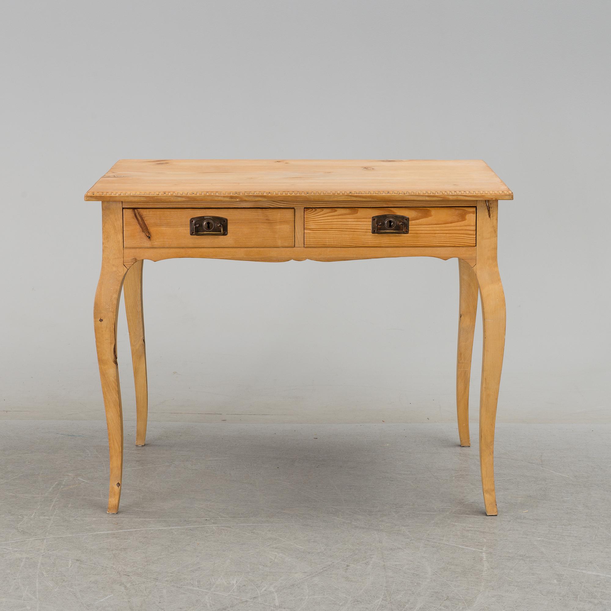 A 20th century rococo style writing desk.